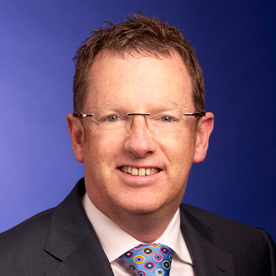 headshot of Tom McGinness