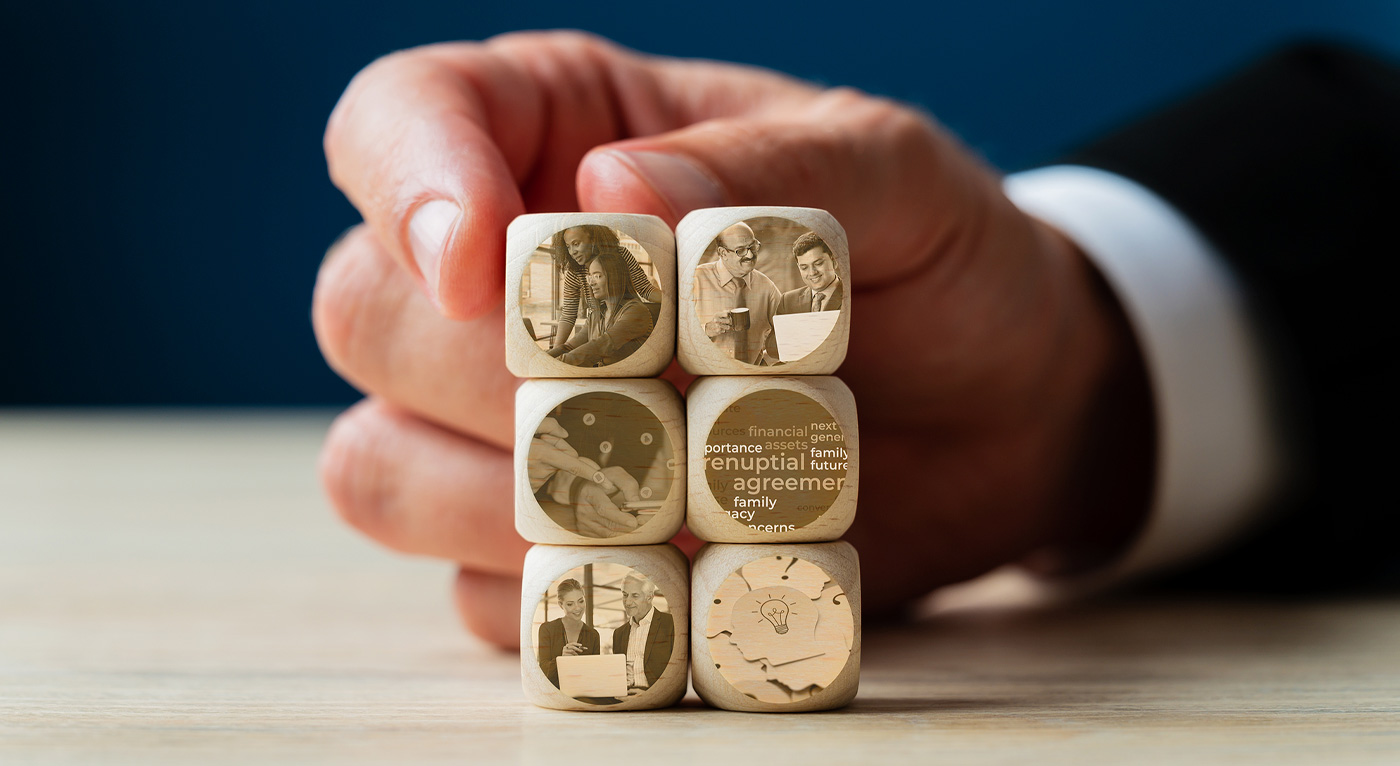 six small wooden blocks stacked on top of each other with different artwork on each
