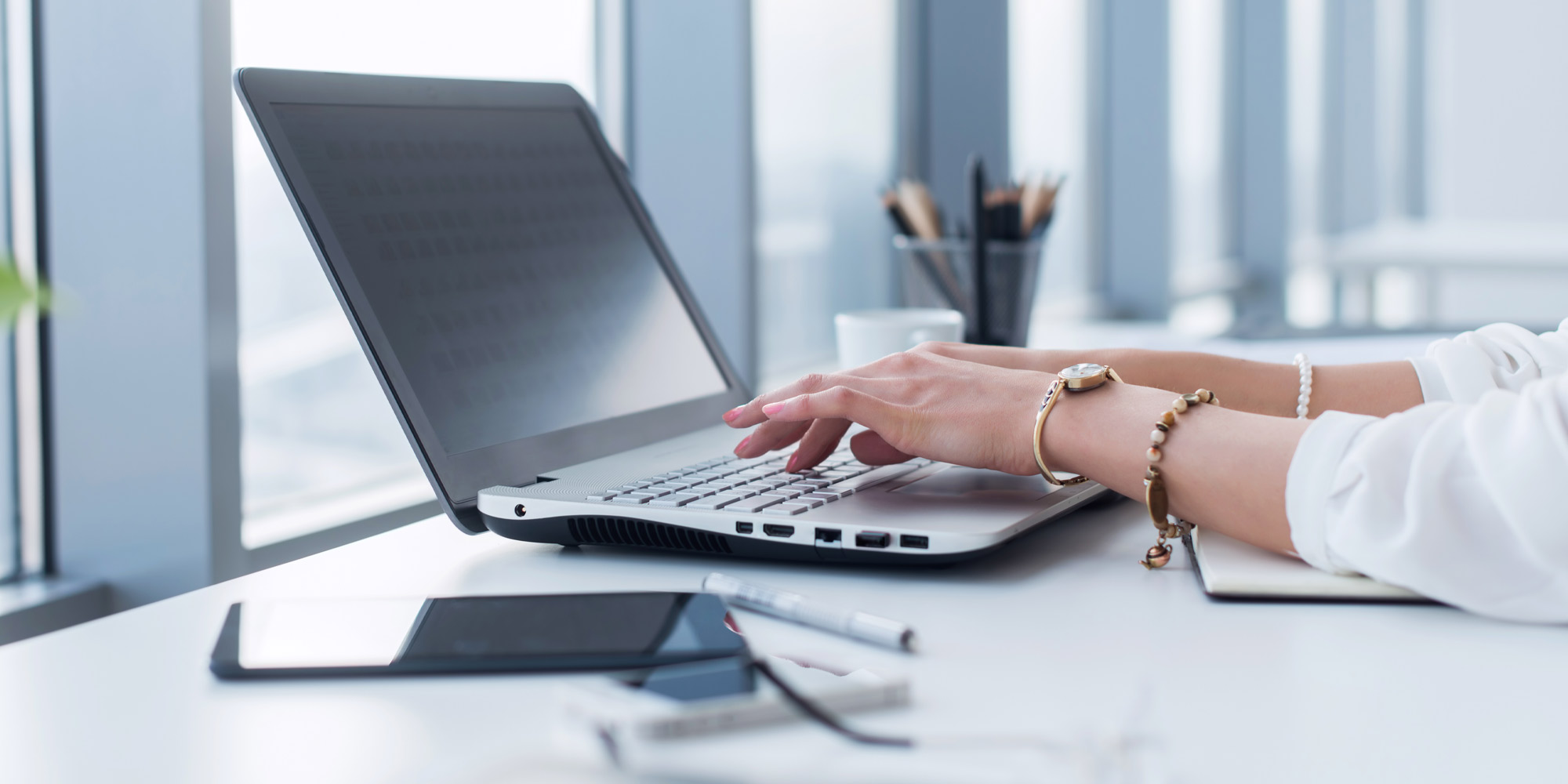woman typing on laptop