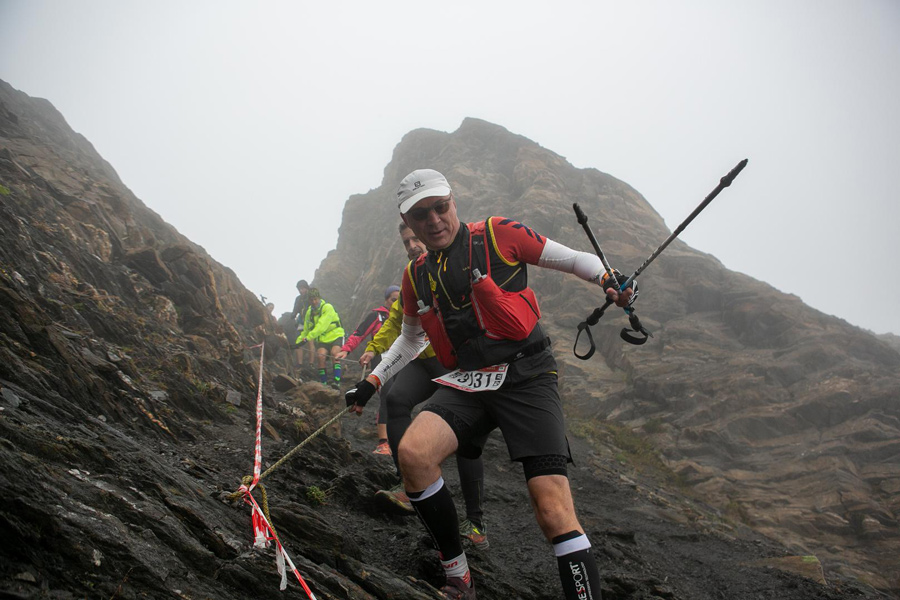 Carlo Salvato climbing a mountainside