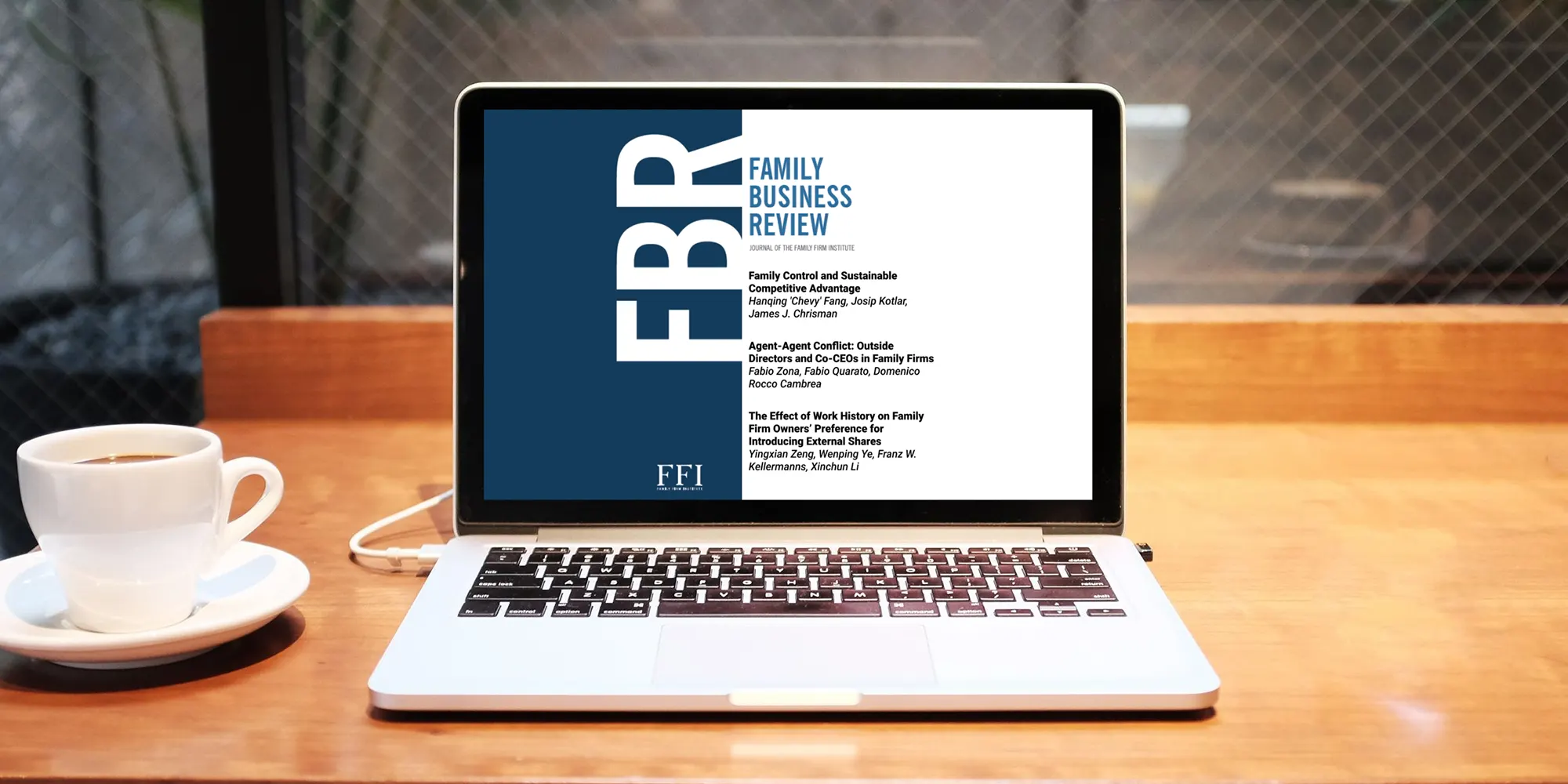 laptop with article from the Family Business Review displayed on it