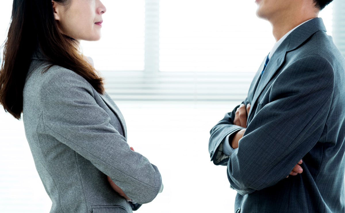 Two businesspeople standing face to face