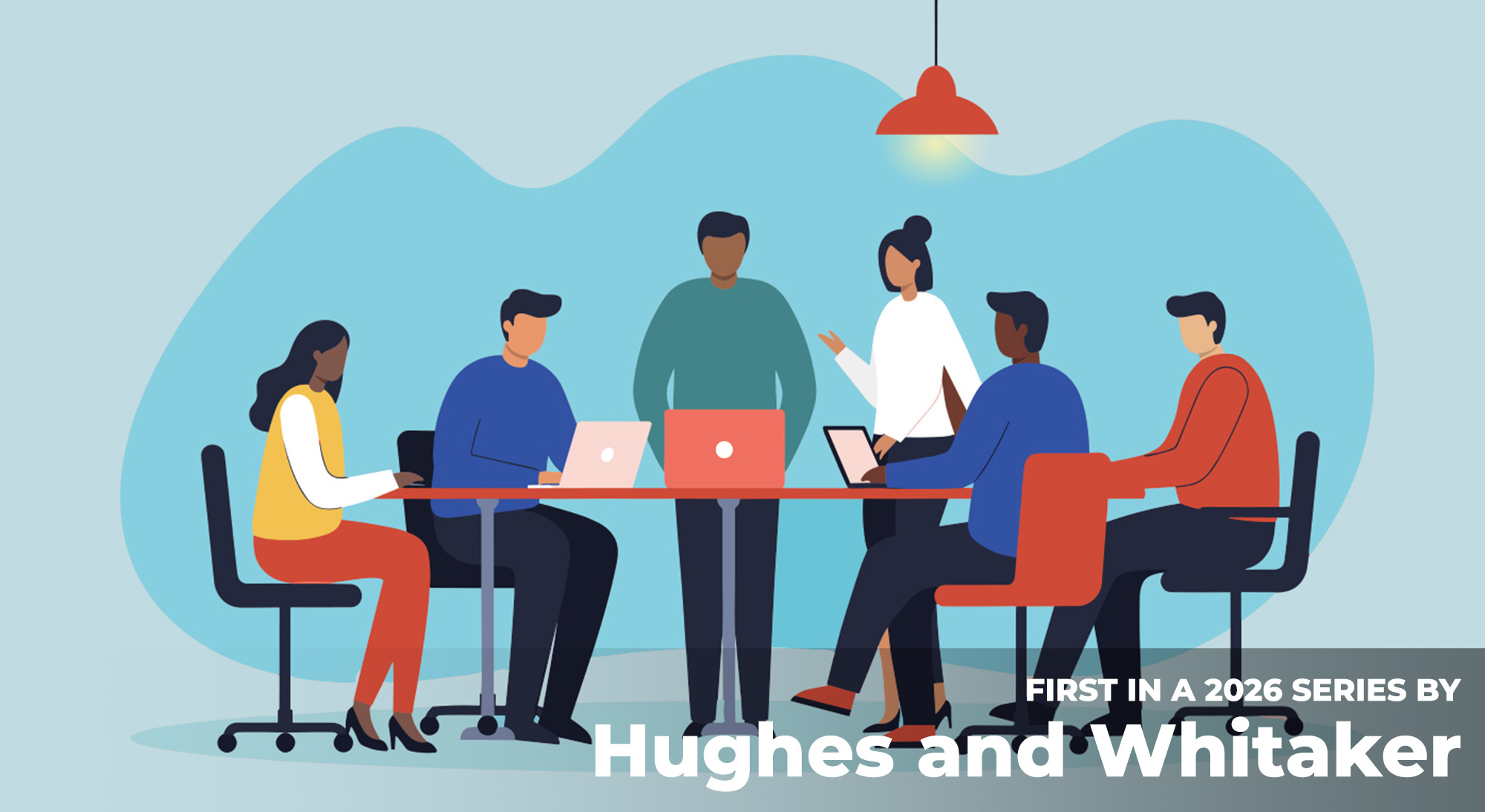 People sitting at table with open laptops