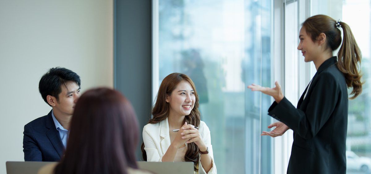 Group of asian business meeting and discussing with new startup idea project. Creative business people planning strategy analysis and brainstorm with document report in office