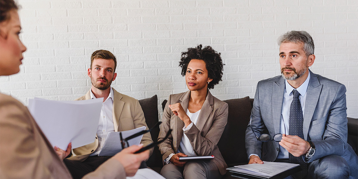 Business people having informal meeting in office